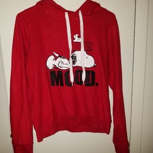 Snoopy hoodie with white drawstrings.